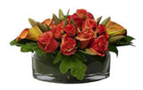 Apricot coloured roses and calla lilies